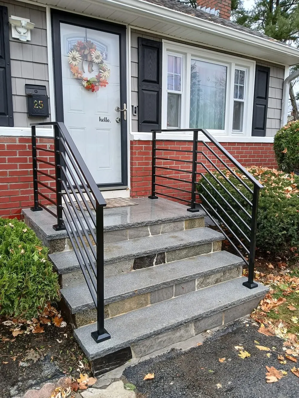 Horizontal railings on granite front steps